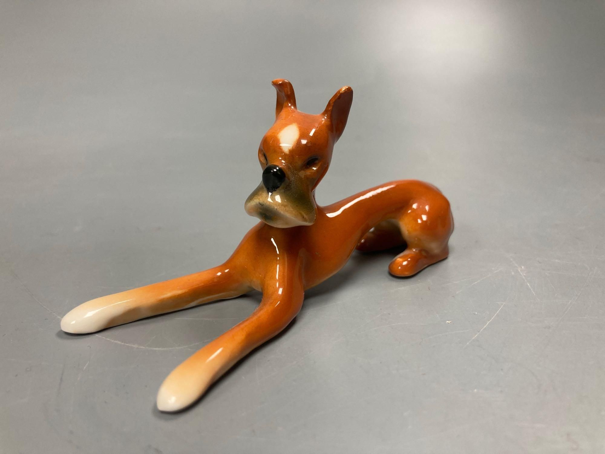 A pair of Goebel ceramic Dobermans, tallest 7.5cm and a pair of miniature Continental Spaniels, 5cm high